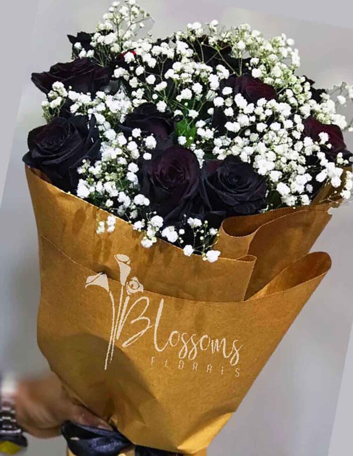 black rose celebration, boutique flower shop Lahore, black rose bouquet, bold floral arrangements, milestone celebration flowers, unique flower gifts, luxury flower bouquets, black rose symbolism,